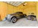 Garage featuring insulated walls, concrete floor, and ample space for vehicles and equipment at 15890 County Road 675, Parrish, FL 34219