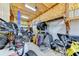 Well-lit garage featuring a car lift, workbench, storage and a customized Jeep at 15890 County Road 675, Parrish, FL 34219