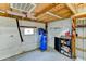 Garage featuring an air compressor, storage shelves, insulated ceiling and walls at 15890 County Road 675, Parrish, FL 34219