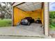 Garage featuring insulated walls, concrete floor, and ample space for vehicles and equipment at 15890 County Road 675, Parrish, FL 34219