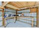 Well-lit garage space with workbench, wood framing, ample workspace and storage at 15890 County Road 675, Parrish, FL 34219