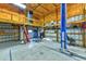 Spacious garage space with equipment, ample storage, lift, and great lighting for any project at 15890 County Road 675, Parrish, FL 34219