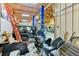 Cluttered garage with Jeep, motorcycle, car lift, work area, and insulated walls at 15890 County Road 675, Parrish, FL 34219