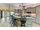 Charming kitchen with bar seating, stainless steel appliances and modern cabinetry at 15890 County Road 675, Parrish, FL 34219