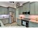 Close up of the kitchen showing stainless appliances, granite countertops and updated cabinetry at 15890 County Road 675, Parrish, FL 34219