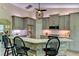 Kitchen with stainless steel appliances, granite counters, gray cabinets and a dining bar at 15890 County Road 675, Parrish, FL 34219