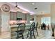 Charming kitchen with breakfast bar, stainless appliances and modern cabinetry with wood look floors at 15890 County Road 675, Parrish, FL 34219