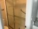 Bathroom showcasing the glass shower with grab bars and tiled surround at 1697 Brookhouse Cir # 116, Sarasota, FL 34231