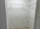 Walk-in closet featuring wire shelving for clothing and storage in a freshly painted room at 1697 Brookhouse Cir # 116, Sarasota, FL 34231