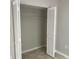 Bedroom closet with bi-fold doors and wire rack shelving is ready for your storage needs at 1697 Brookhouse Cir # 116, Sarasota, FL 34231
