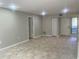 Spacious living room with tile flooring, neutral paint, and ample natural light at 1697 Brookhouse Cir # 116, Sarasota, FL 34231