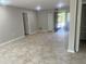 Open living room with tile flooring, neutral paint, and a bright, airy feel at 1697 Brookhouse Cir # 116, Sarasota, FL 34231