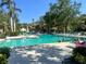 Community pool offering a refreshing space to swim and socialize with lounge chairs at 1697 Brookhouse Cir # 116, Sarasota, FL 34231