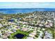 Stunning aerial view showcasing homes within a community, ponds, and beautiful waterfront scenery at 1720 85Th Nw Ct, Bradenton, FL 34209