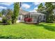 Lush backyard featuring a screened lanai and meticulously maintained lawn at 1720 85Th Nw Ct, Bradenton, FL 34209