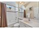 Clean bathroom with tiled shower and tub, large mirror, and updated vanity at 1720 85Th Nw Ct, Bradenton, FL 34209