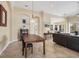 Open-concept dining room with archways, tile flooring, and natural light at 1720 85Th Nw Ct, Bradenton, FL 34209