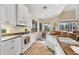Eat-in kitchen showcases white cabinetry, granite counters, and breakfast nook at 1720 85Th Nw Ct, Bradenton, FL 34209