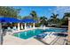 Enjoy the community's lovely pool with blue canopies, comfortable lounge chairs and palm tree views at 1720 85Th Nw Ct, Bradenton, FL 34209