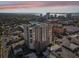 Stunning aerial view of the high-rise building with a beautiful waterfront backdrop and vibrant city skyline at sunset at 1771 Ringling Blvd # 1001, Sarasota, FL 34236