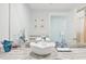 Bright bathroom features a vessel sink, granite counters, and beach-themed decor at 1771 Ringling Blvd # 1001, Sarasota, FL 34236