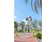 A beautiful view of a kissing sculpture, set against a bright blue sky at 1771 Ringling Blvd # 1001, Sarasota, FL 34236