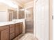 Bathroom featuring a glass enclosed shower and ample storage at 19962 Benissimo Dr, Venice, FL 34293