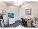 Inviting room with a modern media center, desk, and stylish decor, perfect for relaxing or working at 19962 Benissimo Dr, Venice, FL 34293
