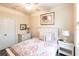 Bedroom showcasing a cozy bed with decorative pillows and a window at 19962 Benissimo Dr, Venice, FL 34293