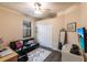Functional bedroom featuring a futon sofa, desk, and sleek, modern design elements at 19962 Benissimo Dr, Venice, FL 34293