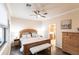 Comfortable main bedroom with light wood furnishings and ensuite bathroom access at 19962 Benissimo Dr, Venice, FL 34293