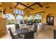 Inviting outdoor lounge area with multiple seating options and a ping pong table at 19962 Benissimo Dr, Venice, FL 34293