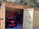 Wood storage shed with mower and tools for yard maintenance and storage at 21487 Fairway Ave, Port Charlotte, FL 33952