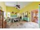 Bright bedroom features vaulted ceiling, ceiling fan, and a mix of antique and painted furnishings at 215 Santarem Cir, Punta Gorda, FL 33983