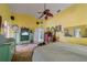 Spacious bedroom with vaulted ceiling, ceiling fan, and a view into the en-suite at 215 Santarem Cir, Punta Gorda, FL 33983