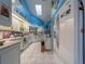 Bright kitchen with white cabinetry, tile floors, and modern appliances at 215 Santarem Cir, Punta Gorda, FL 33983