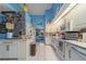 Bright kitchen with white cabinetry, tile floors, and modern appliances at 215 Santarem Cir, Punta Gorda, FL 33983