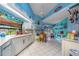 Spacious kitchen featuring white cabinets, ample counter space, and bright lighting at 215 Santarem Cir, Punta Gorda, FL 33983