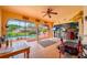 Enclosed lanai features access to the pool area, exercise equipment, and comfortable seating at 215 Santarem Cir, Punta Gorda, FL 33983