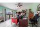 Office space featuring desk, chair, window, and built-in shelves at 215 Santarem Cir, Punta Gorda, FL 33983