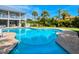 A tranquil pool area with meticulous landscaping offers a serene backyard setting at 217 Spring Ave, Anna Maria, FL 34216