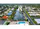 Stunning aerial view of the canal homes and community pool at 2419 Riverbluff Pkwy # V233, Sarasota, FL 34231