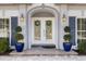 Elegant double front doors with glass inserts and sidelights at 28 Dominica Dr, Englewood, FL 34223