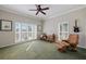 Bright home office area with a desk, leather chair and lots of natural light from the window at 28 Dominica Dr, Englewood, FL 34223