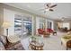 Inviting lanai with multiple seating areas, offering panoramic views of the water and outdoor pool at 28 Dominica Dr, Englewood, FL 34223
