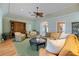 Bright living room featuring ample seating and a large ceiling fan at 28 Dominica Dr, Englewood, FL 34223