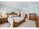 Light and bright main bedroom with a king bed and an ensuite bathroom at 28 Dominica Dr, Englewood, FL 34223