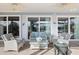Inviting screened-in patio with comfortable seating and lovely backyard views at 28 Dominica Dr, Englewood, FL 34223