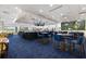 Restaurant and bar area with high ceilings, multiple TVs and a view of the 19th Hole at 28 Dominica Dr, Englewood, FL 34223