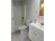 Bathroom with a toilet, tub, and vanity featuring cabinet storage at 3722 S Cranberry Blvd, North Port, FL 34286